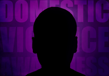 A silhouette of a boy against a purple backdrop with the word 'Domestic Violence Awareness' written on it