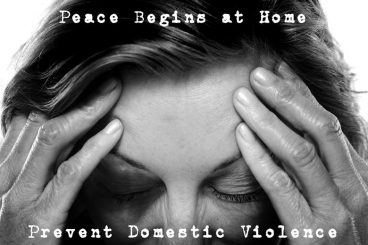 Black-and-white portrait of a woman clutching her head, with the text 'Peace Begins at Home...Prevent Domestic Violence' written on it