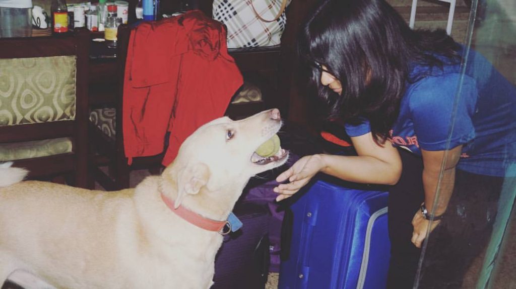 Swara Shukla playing with her pet dog Dobby in India