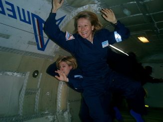 Esther Dyson smiling and floating inside a zero-g stimulator