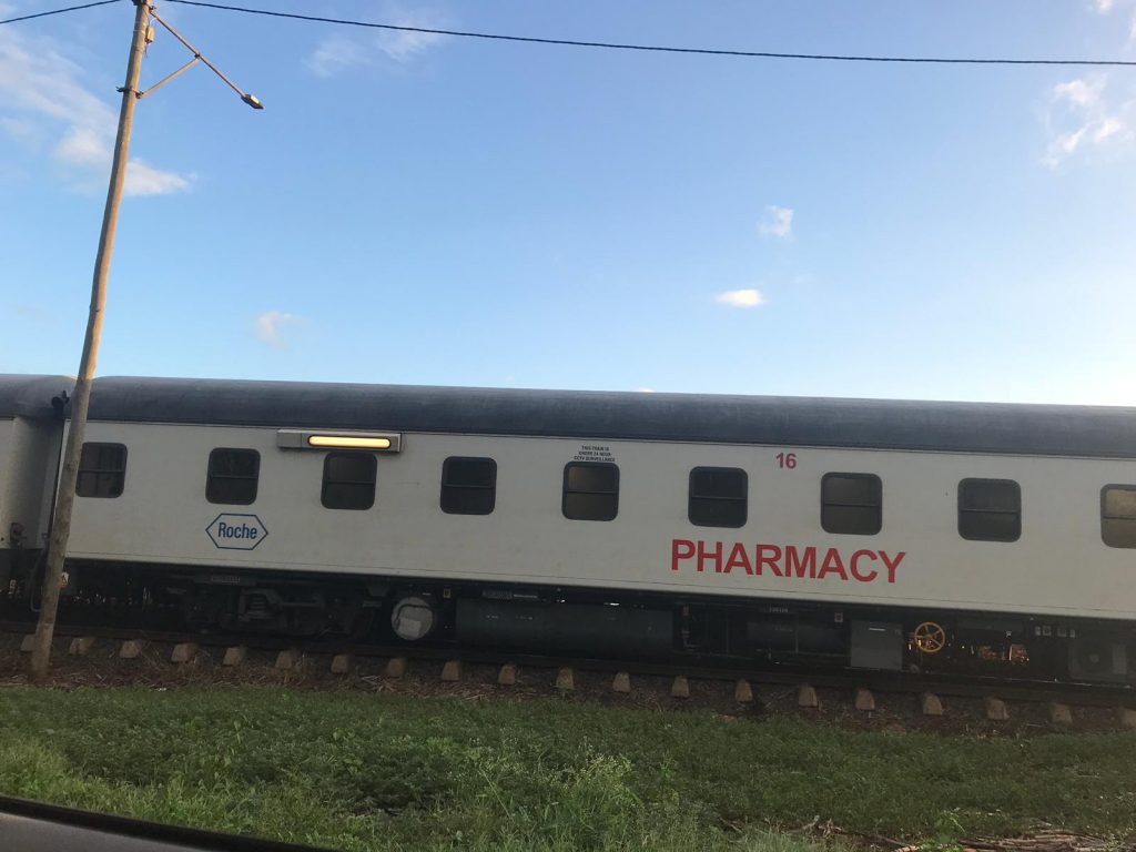 A train-coach in South Africa with 'Pharmacy' written on it